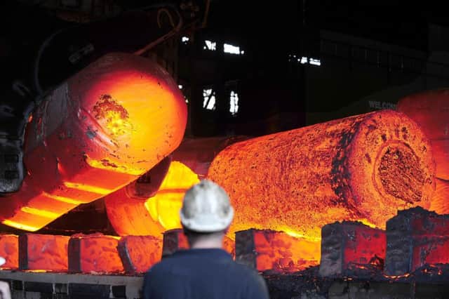 Red hot metal being moved across the heavy forge at the Forgemasters in Sheffield.  Picture: John Giles/PA Wire
