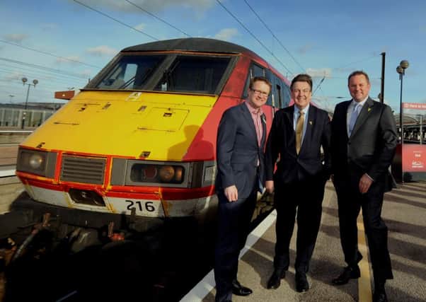 Culture Secretary John Whittingdale (centre) pictured with Sir Gary Verity and David Horne the MD for Virgin Trains East Coast, at York Station. Picture by Simon Hulme