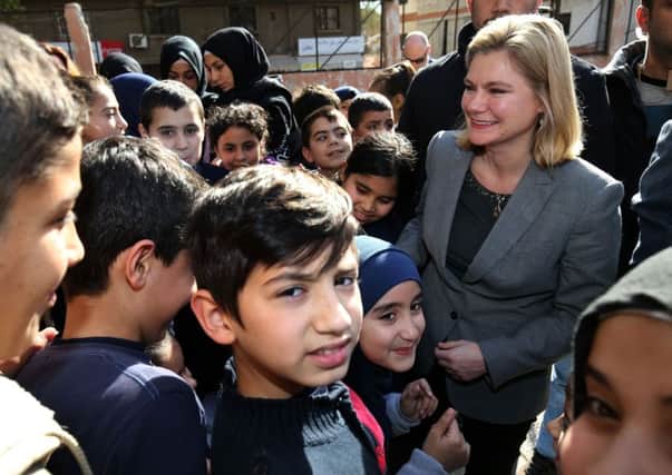 Secretary of State for International Development Justine Greening (right), during a tour of the Bourj Hammoud School, a mixed school teaching Lebanese and Syrian children in Beirut, Lebanon, to see how the UK's response and aid is helping the refugee crisis.