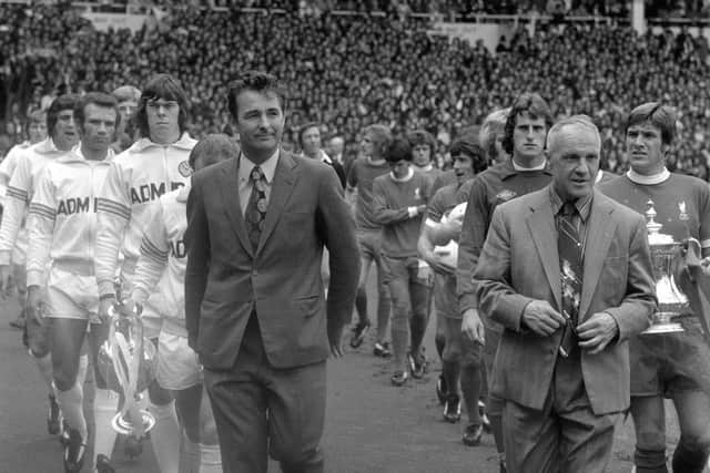 Brian Clough, new manager of Leeds United and Bill Shankly, retiring manager of Liverpool leading their men out for the FA Charity Shield match at Wembley.