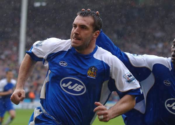 Wigan Athletic's David Unsworth, left, celebrates scoring a penalty against Sheffield United that ultimately relegated the Blades from the Premier League in 2007.