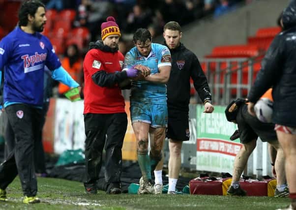 Huddersfield Giant's Scott Grix leaves the match with an injury.