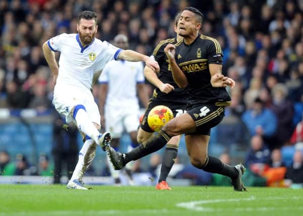 Leeds United's Mirco Antenucci kicks the ball into the path of Nottingham Forest's Michael Mancienne.
