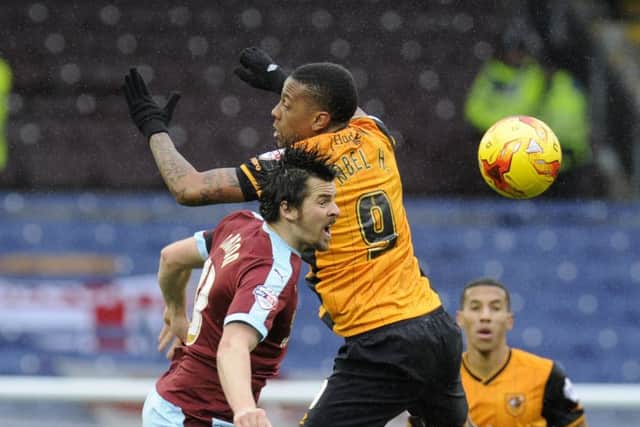 Joey Barton and Abel Hernandez challenge for a high ball. Picture: Bruce Rollinson
