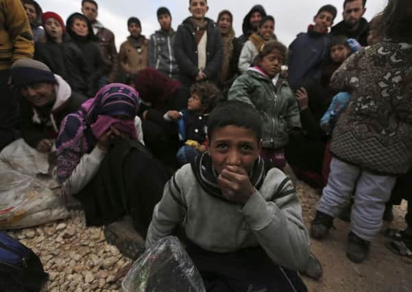 Thousands of Syrians have gathered at the Turkish border