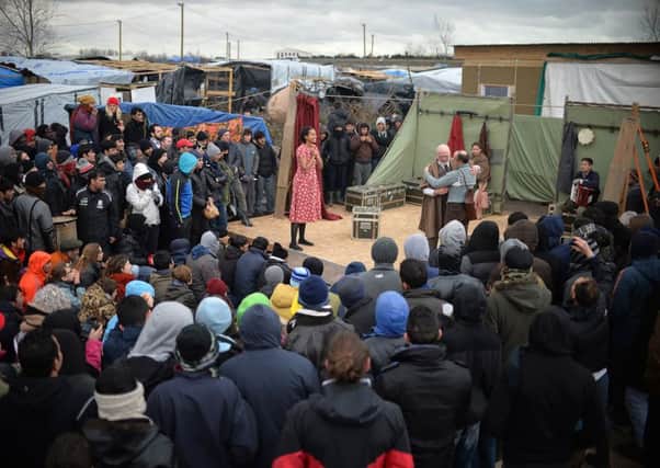 Actors from Shakespeare's Globe, stage a performance of Hamlet in front of dozens of refugees and migrants at "the Jungle" camp in Calais, France.  The London-based theatre company took its world touring production of the Bard's timeless tragedy for a one-off performance at the sprawling site in northern France.