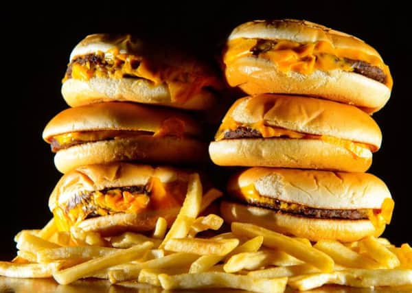 A pile of cheeseburgers and french fries, as three-quarters of adults support a ban on junk food advertising before the 9pm TV watershed, according to a new poll.