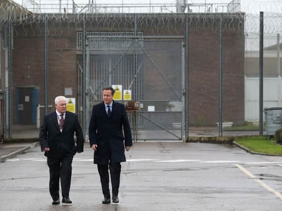 David Cameron with prison governer Stephen Ruddy at HMP Onley in Rugby.