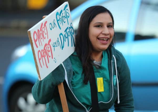 A junior doctor on the picket line outside Sheffield's Royal Hallamshire Hospital.
