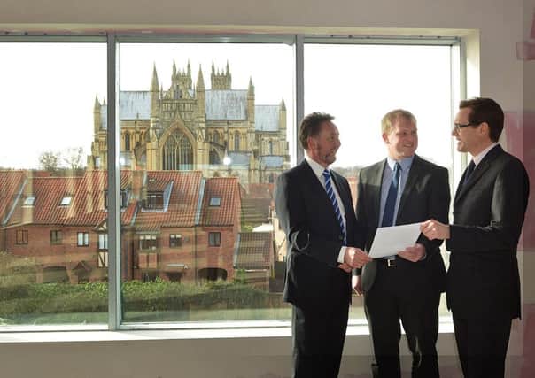 Wykeland Group Estates Surveyor John Gouldthorp, centre, with letting agents Nick Pearce, left, and Tim Powell inside Armstrong House, which offers great views of the magnificent Beverley Minster.