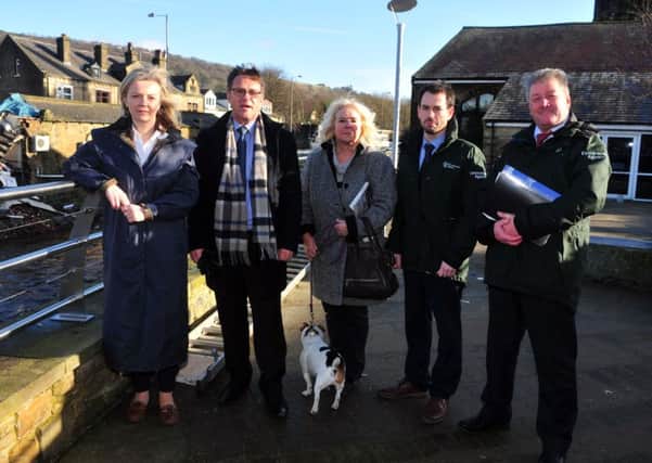 Elizabeth Truss MP, Secretary of State for Environment, Food and Rural Affairs with Craig Whitaker MP, Cllr Jill Smith-Moorhouse and Adrian Gill with Mark Scott from the Enviroment Agency  during a quick visit to see Mytholmroyd following the floods over Christmas.