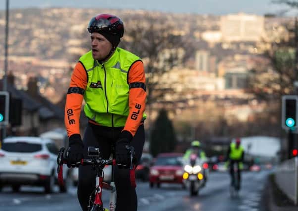 Greg James cycles in Sheffield as part of his Sport Relief challenge