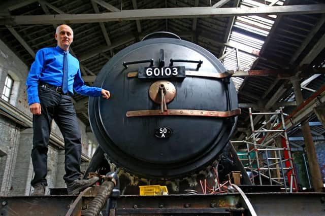Curator of Collections and Research at the National Railway Museum Bob Gwynne checks on restoration work