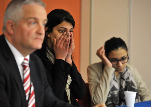 Det Supt Simon Atkinson with Asma Razaq and daughter Neha at a press conference for the disappearance of their husband and father Sajid Saddique. Picture: Tony Johnson