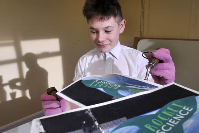 Scarborough's Pupil Referral Unit  practice their horticultural skills as they prepare to grow seeds from outer space.Working until the sun sets. Kevin Junior McHale prepares his cosmic challenge.. pic Richard Ponter 160619d