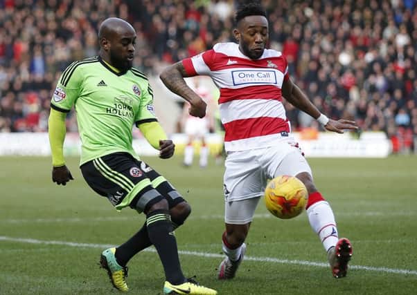 Jamal Campbell Ryce is tackled by Cedric Evina.