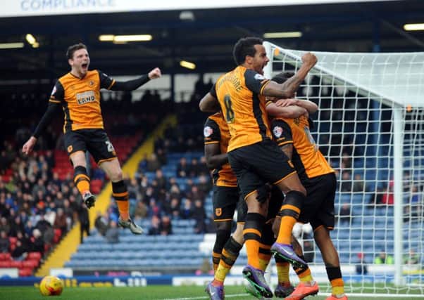 Hull player Abel Hernandez is mobbed by his team-mates after his goal.  Picture by Simon Hulme