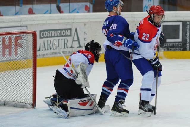 Sheffield Steelers' GB captain Jonathan Phillips, centre, makes a nuisance of himself in front of net against Serbia. Picture: Colin Lawson.