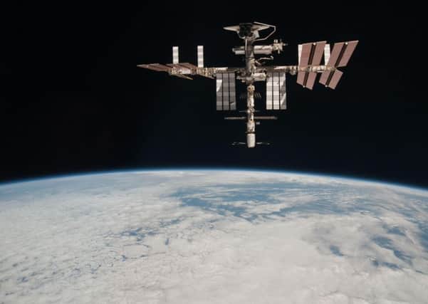 The International Space Station above Earth (AP Photo/NASA, Paolo Nespoli)