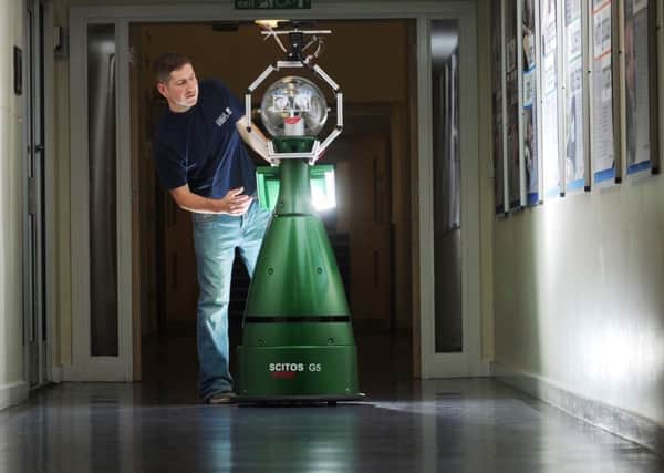 Graham Brown pictured with 'Lucy' the Robot at the Mechanical Engineering Department at Leeds University....SH1002009b..21st October 2014 Picture by Simon Hulme