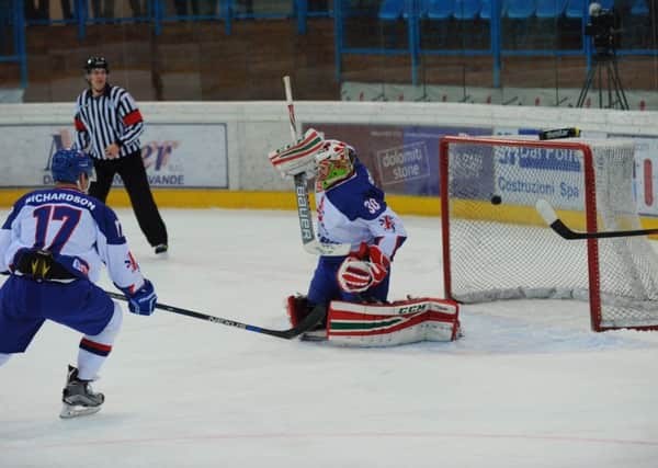 GB goalie Ben Bowns, from Rotherham, can't stop Italy's opening goal on Sunday night in Cortina. Picture courtesy of Colin Lawson.