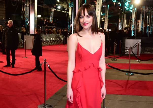 Dakota Johnson attending the EE British Academy Film Awards at the Royal Opera House, Bow Street, London. PIC: PA