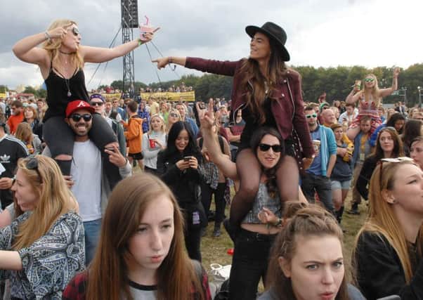 Festival goers letting their hair down at the Leeds Festival. (Photo: Adrian Murray.)