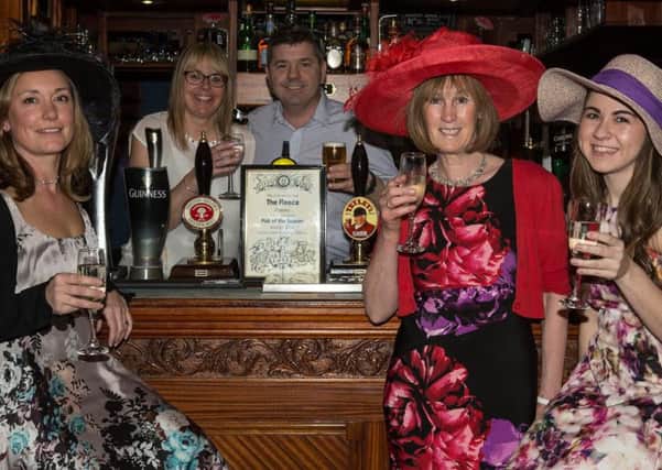 Fleece pub owners Kate and Paul Lorryman  (pictured behiond the bar) with (from L to R) Jo Lyons, Chris Porter and Sara Thompson