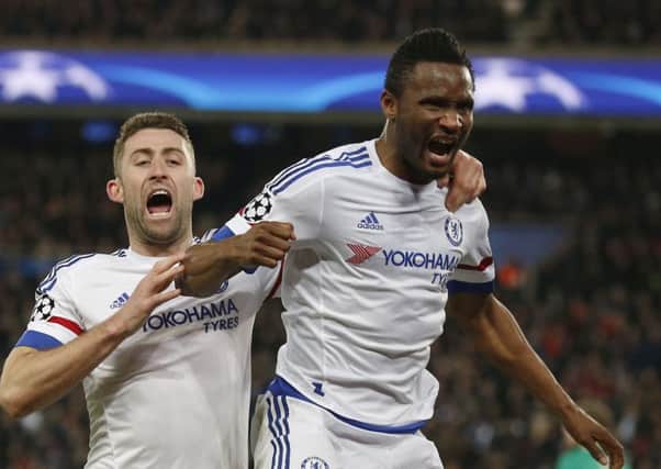 Chelsea's John Obi Mikel, right, celebrates with team-mate Gary Cahill.