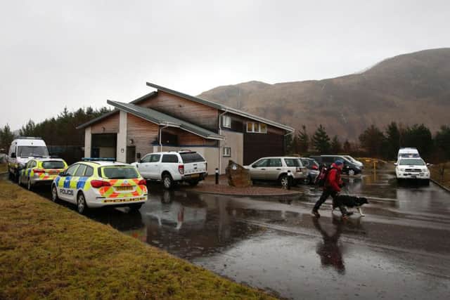 Police activity around the Lochaber Mountain Rescue Team headquarters in Fort William after a major search for Rachel Slater, 24, and Tim Newton, 27, who are missing on Britain's highest mountain, has been suspended due to "treacherous" weather conditions.
