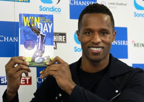Sheffield Wednesday player Jose Semedo with his book Win the Day.