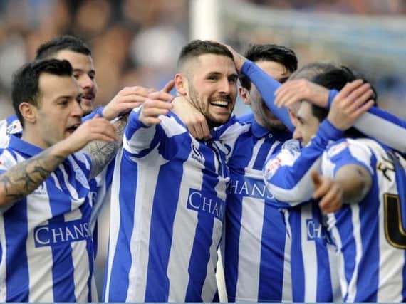 Gary Hooper celebrates with team mates after one of two goals against Leeds at the weekend - but will he be back at Hillsborough?