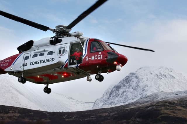 A Coastguard Search and Rescue helicopter searches along the north face of Ben Nevis for missing climbers Rachel Slater, 24, and Tim Newton, 27, as efforts to locate the couple have been been delayed by more bad weather.