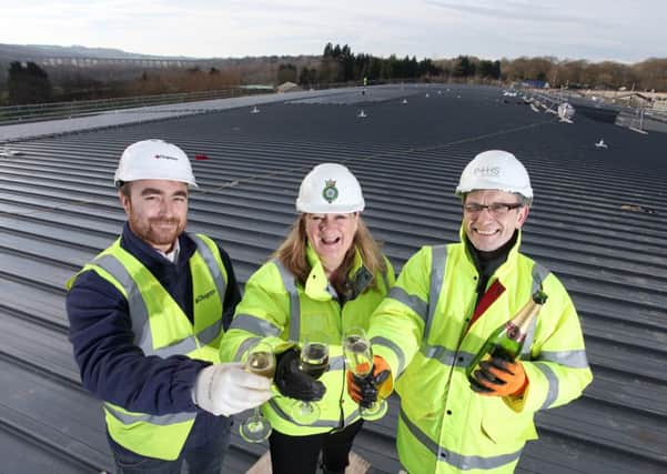 Left to right: Jon Cousins, site manager of Clugston Construction, Heather Parry, deputy chief executive of the Yorkshire Agricultural Society, and Adrian Taylor, director of P+HS Architects.