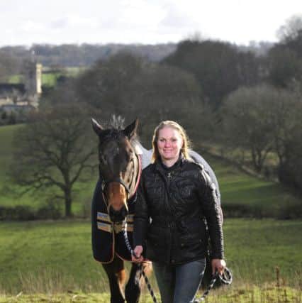 Marti Mulhall with Infantry Officer one of the horses she trains for Point to Point at Thorner Hall Farm, Leeds.   Picture: Bruce Rollinson