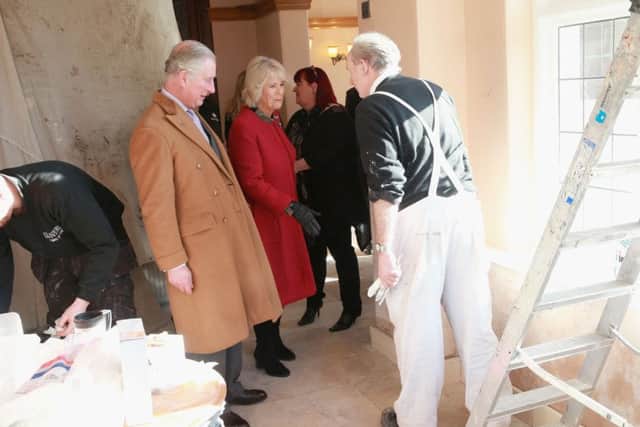 The Prince of Wales and the  Duchess of Cornwall visit the New Inn in The Square