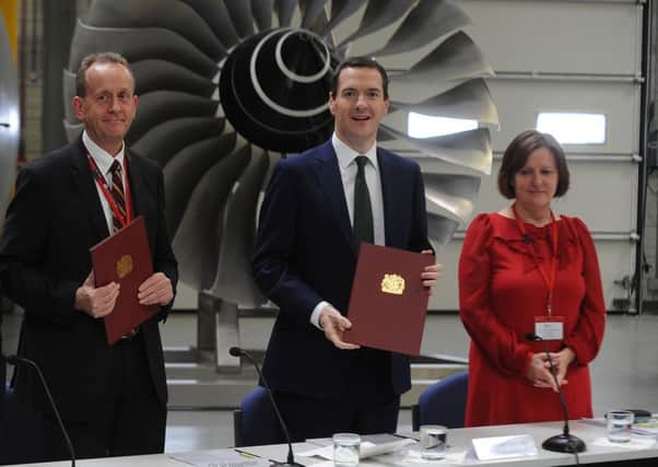 Barnsley Council leader Sir Steve Houghton, Chancellor George Osborne and Sheffield City Council leader Julie Dore at the signing of the deal