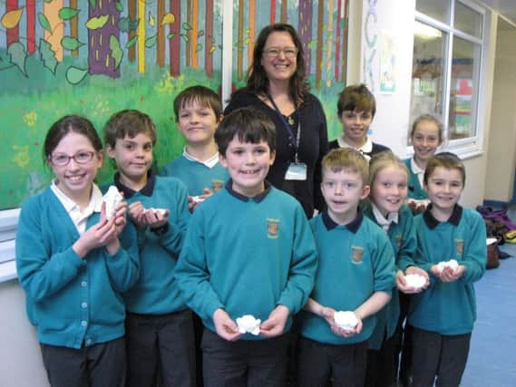 Success - Oatlands Junior School's specialist at teacher Sam Joseph with some of the school children and sculptures which will be exhibited at the Saatchi Gallery in London.