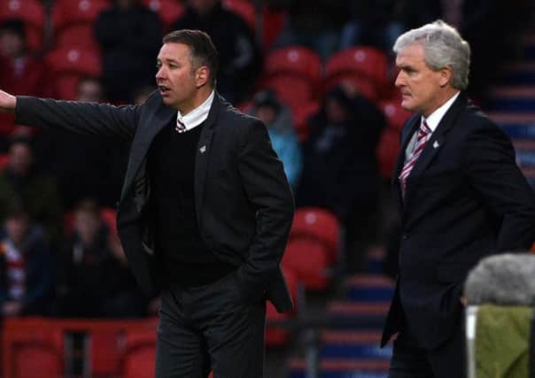 Doncaster Rovers' manager Darren Ferguson with Stoke City manager and former Manchester United team-mate Mark Hughes.