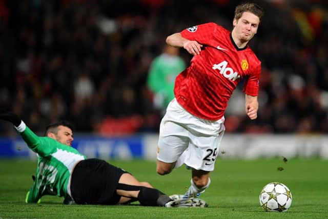 Manchester United's Nick Powell (right) is challenged by CFR Cluj-Napoca's Ricardo Cadu during the UEFA Champions League match at Old Trafford, Manchester.