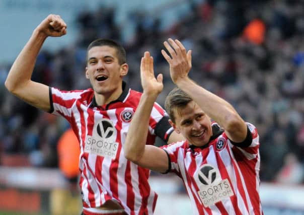 Sheffield United's goalscorer Conor Coady and Chris Porter celebrate knocking Forest out in 2014. (Picture: Jonathan Gawthorpe).