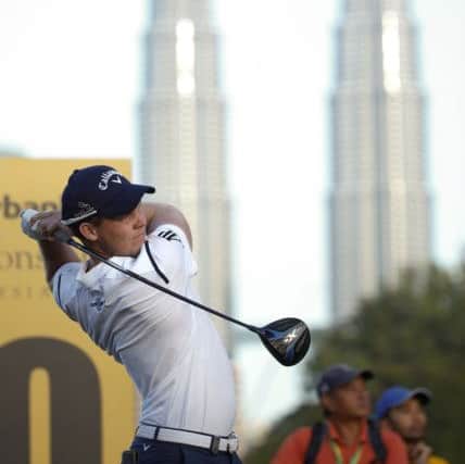 Danny Willett hits a shot during day two of the Maybank Championship golf tournament in Kuala Lumpur, Malaysia. (AP Photo/Vincent Thian)