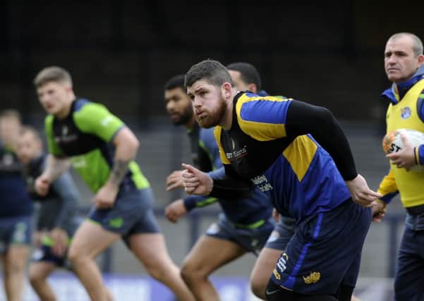 Mitch Garbutt, foreground, leads Leeds Rhinos through their paces in a training session at Headingley Carnegie yesterday ahead of their World Club Challenge match with North Queensland Cowboys (Picture: Bruce Rollinson).