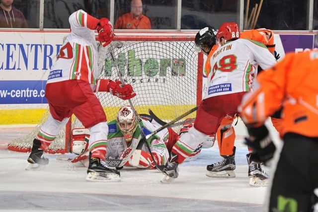 NOT THIS TIME: Cardiff Devils' Ben Bowns smothers the puck to frustrate Sheffield on Saturday night. Picture: Dean Woolley.
