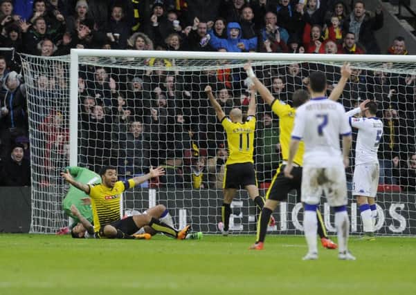 End of the road: Scott Wootton's own goal helps give Watford victory over Leedsin the FA Cup fifth round tie