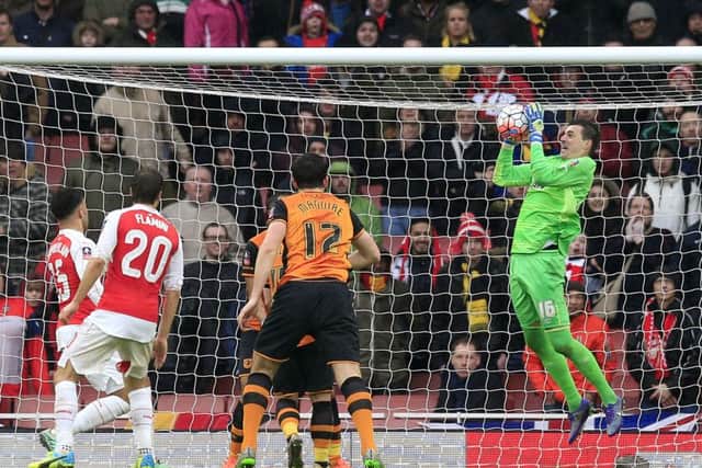 Hull City goalkeeper Eldin Jakupovic makes a save late in the game at Arsenal where the visitors earned a replay (Picture: Jonathan Brady/PA Wire).