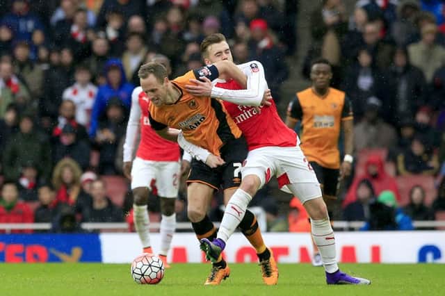 Hull City's David Meyler and Arsenal's Calum Chambers (left) battle for the ball during the Emirates FA Cup, fifth round match at The Emirates Stadium.