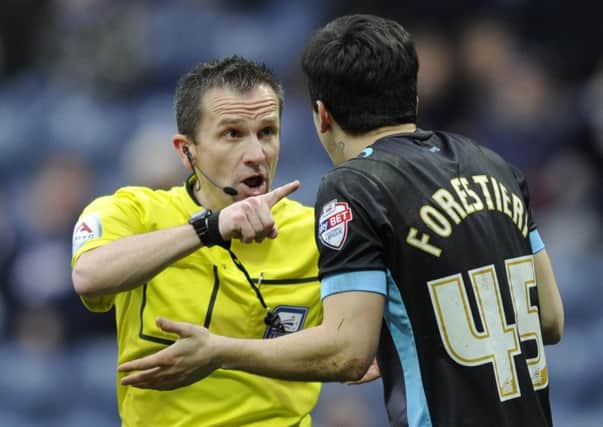 Sheffield Wednesday's Fernando Forestieri protests his innocence in vain before being shown a red card by referee Keith Stroud following two cautionable offences (Picture: Steve Ellis).