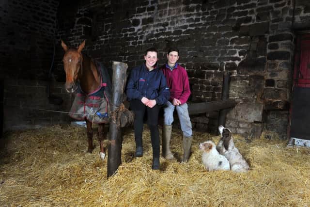 Samantha Drake with her boyfriend, jockey Jonny England at their stables at Guiseley. Picture: Tony Johnson