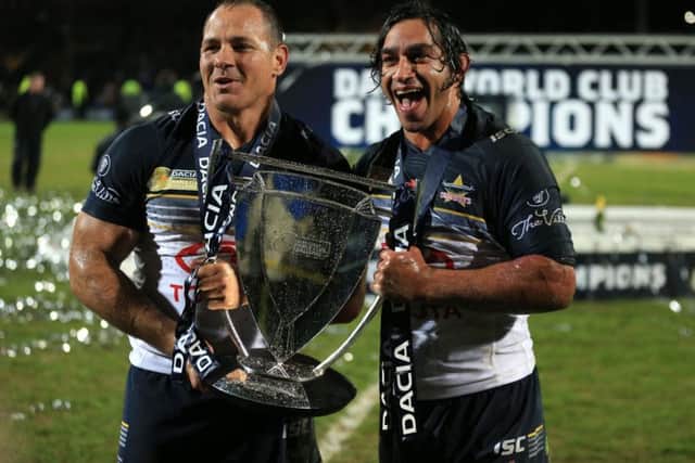North Queensland Cowboys' co-captains Johnathan Thurston(right) and Matthew Scott pose with the World Club Series trophy.